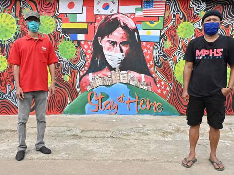 Pinturas y dibujos con mensajes para evitar la propagación del COVID-19, en Indonesia