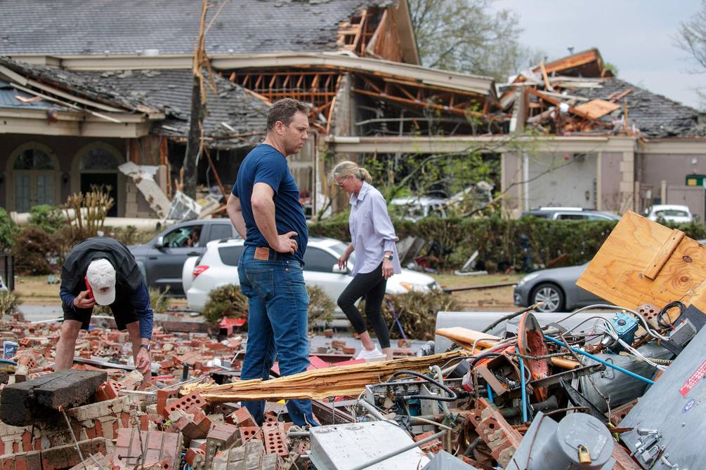Tornadoes and violent storms kill at least eight in the US.